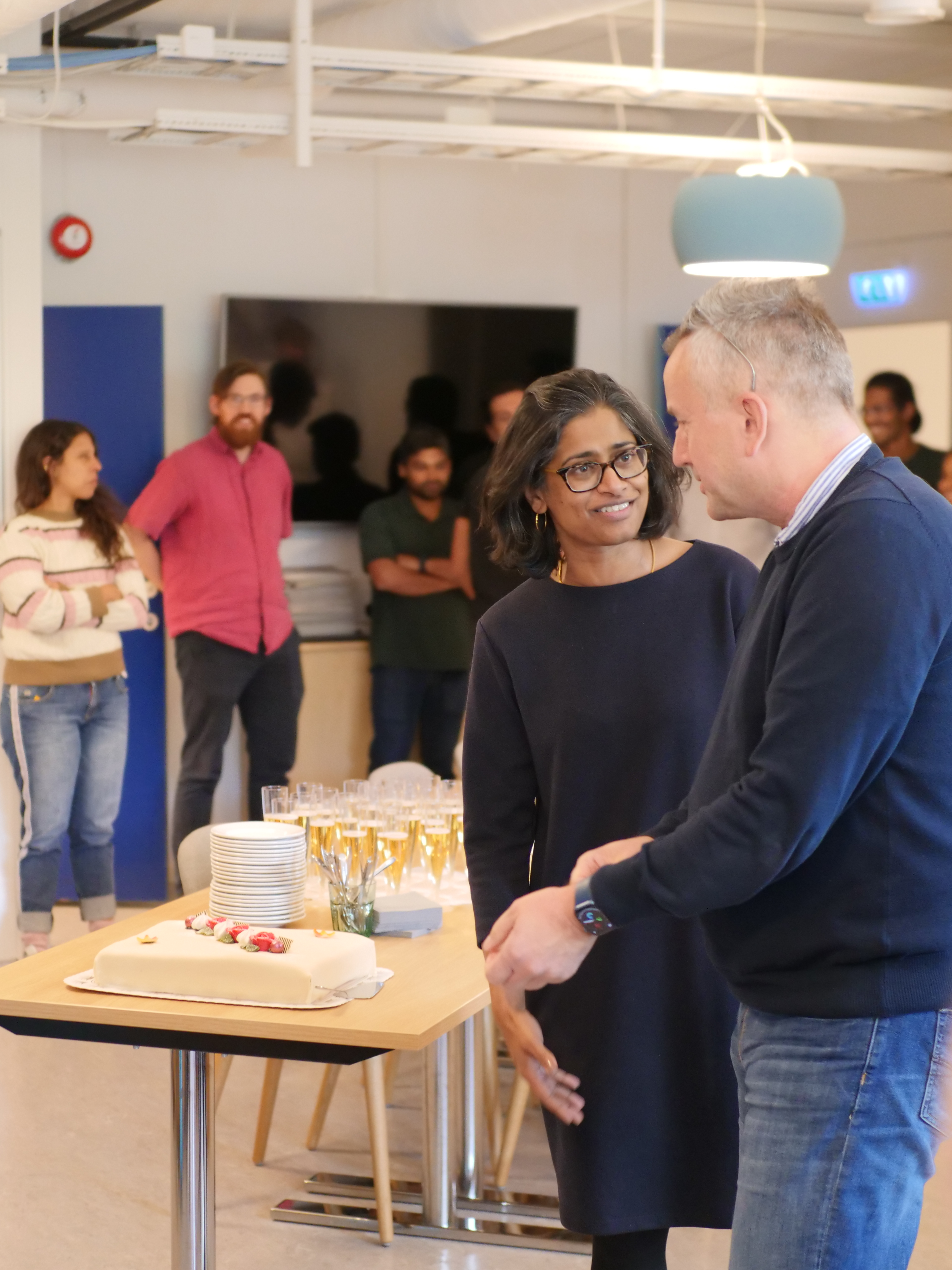 Sushma Grellscheid and Inge Jonassen celebrating ELIXIR4 with cake